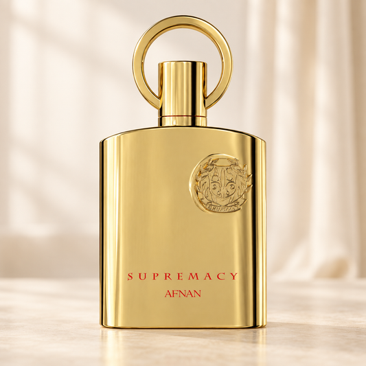 AFNAN - SUPREMACY GOLD, flacone frontale centrale ravvicinato con sfondo leggero