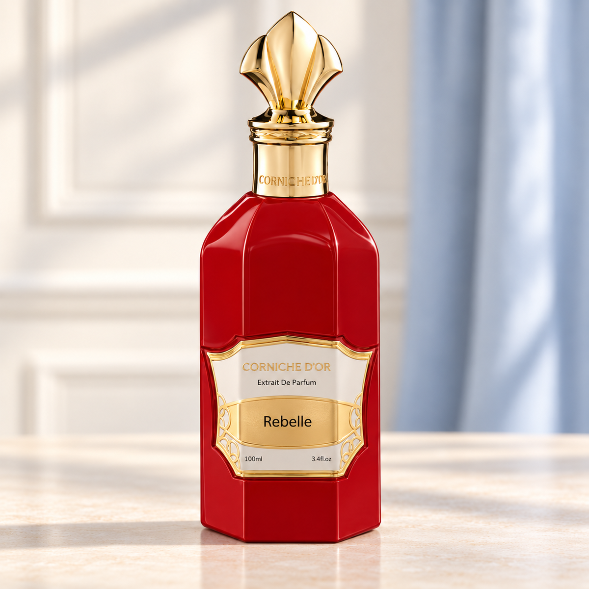 Corniche d'Or Rebelle 100 ml, flacone rosso frontale con dettagli dorati su sfondo chiaro