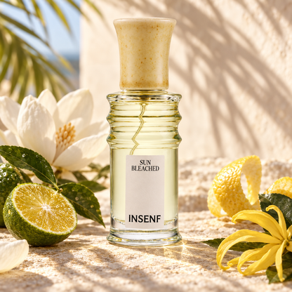 Insenf Sun Bleached tra agrumi e fiori bianchi in luce estiva